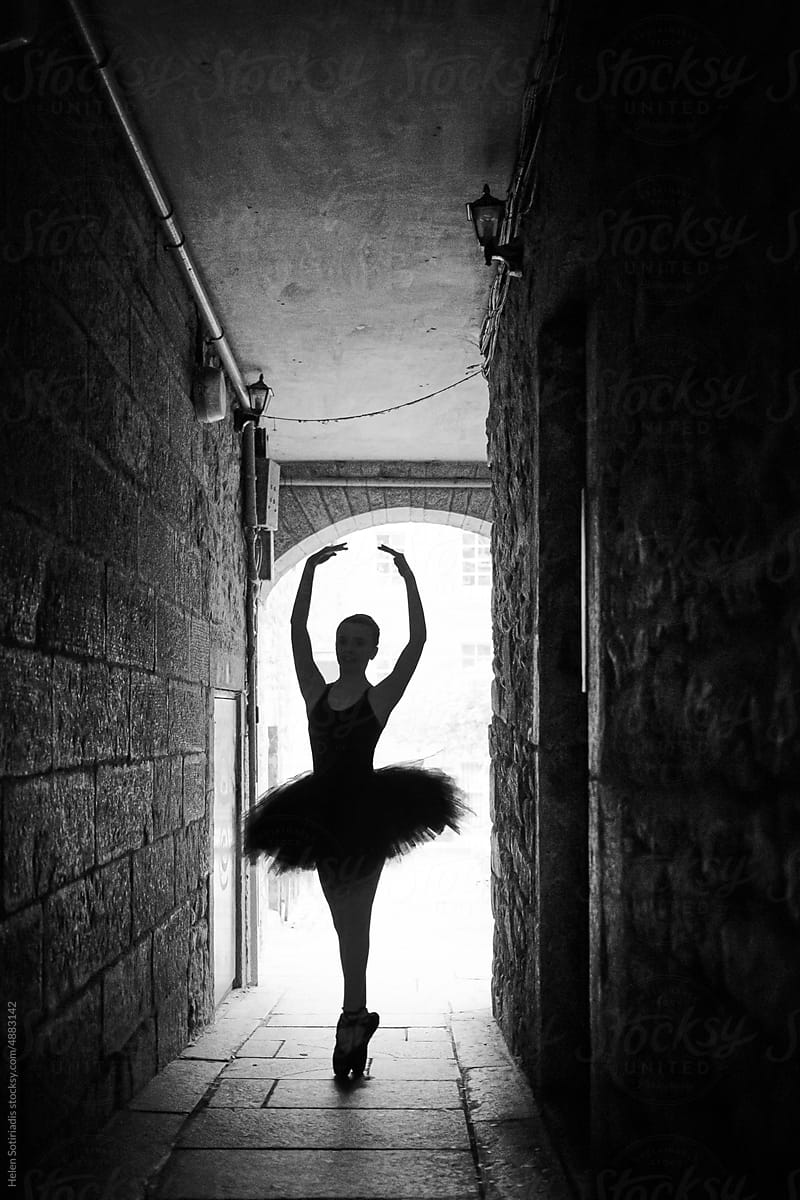 Ballet dancer in a narrow alley