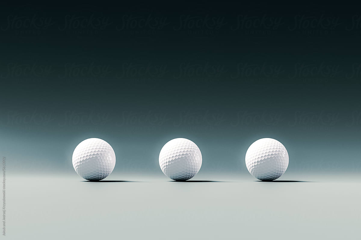 Three White Golf Balls