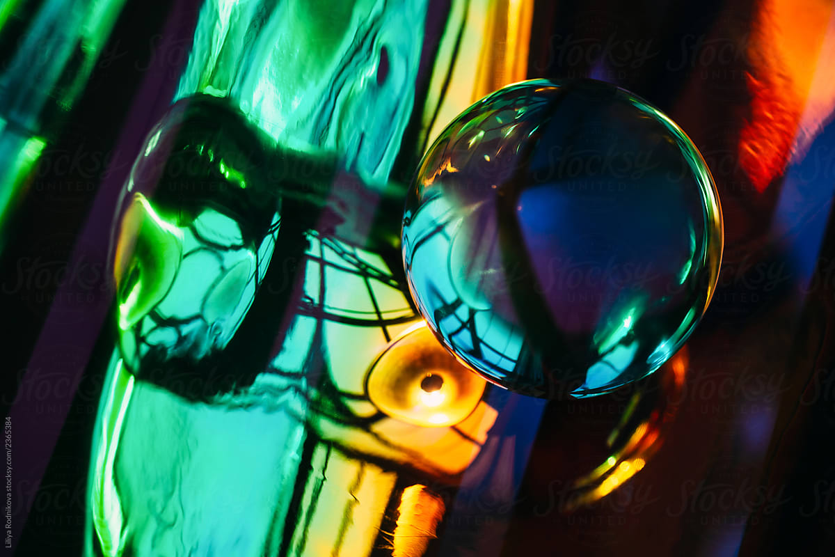 Abstract composition with colorful holographic background and crystal ball