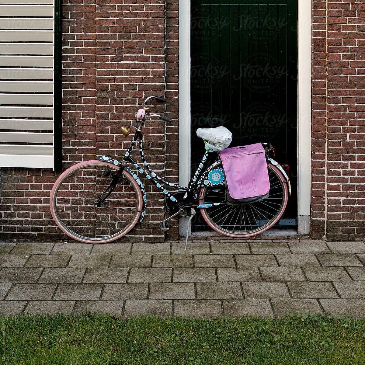 Decorated bicycle in front of a house