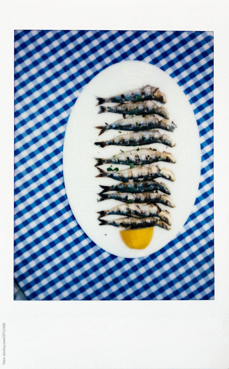 Instant photo of grilled sardines on a table, Paros Island, Greece