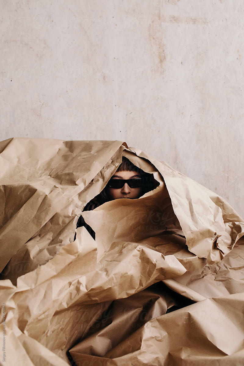 Privacy concept - Spy - Security - Woman hide in paper