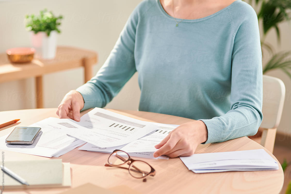 Woman checking documents and paying bills