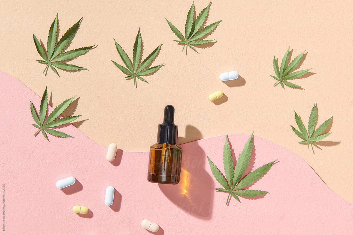 CBD oil, tincture with a pipette on pastel colors background