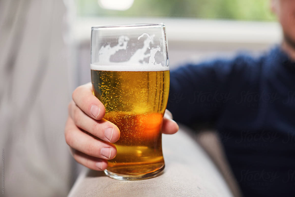 Man holding a pint of beer