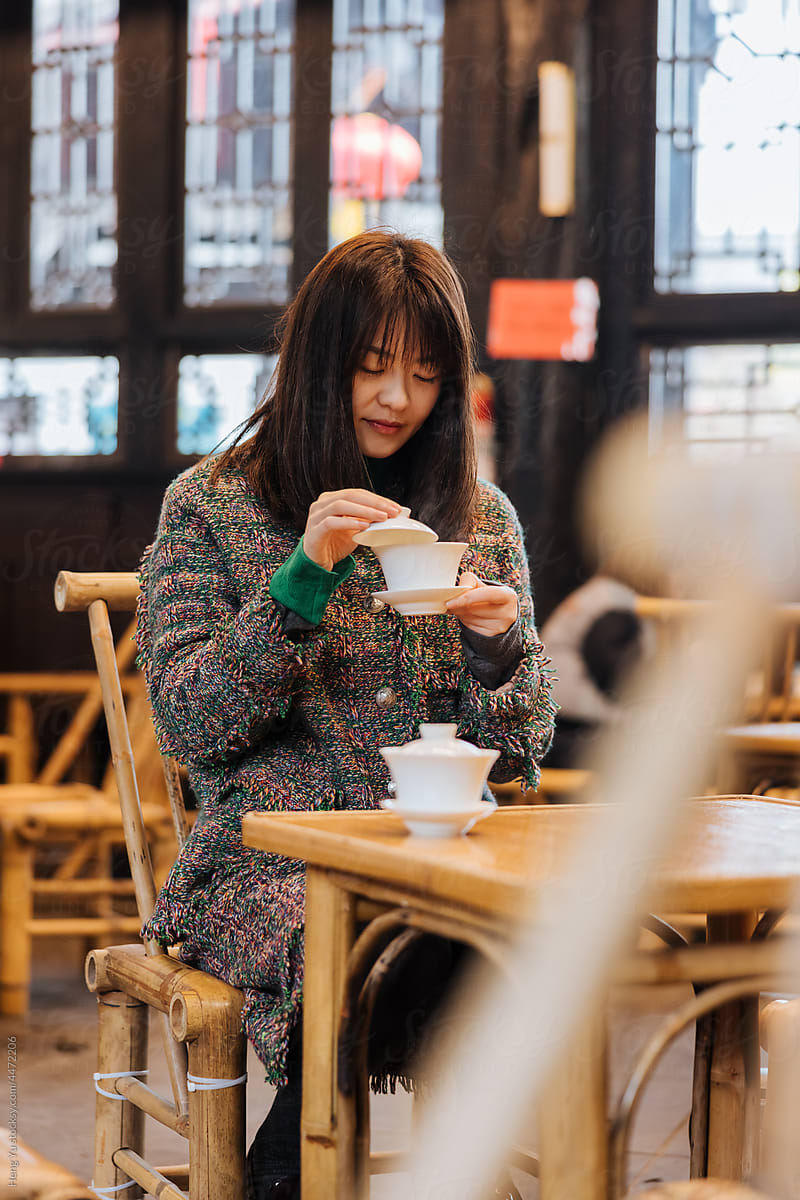 Woman drinking traditional Chinese tea