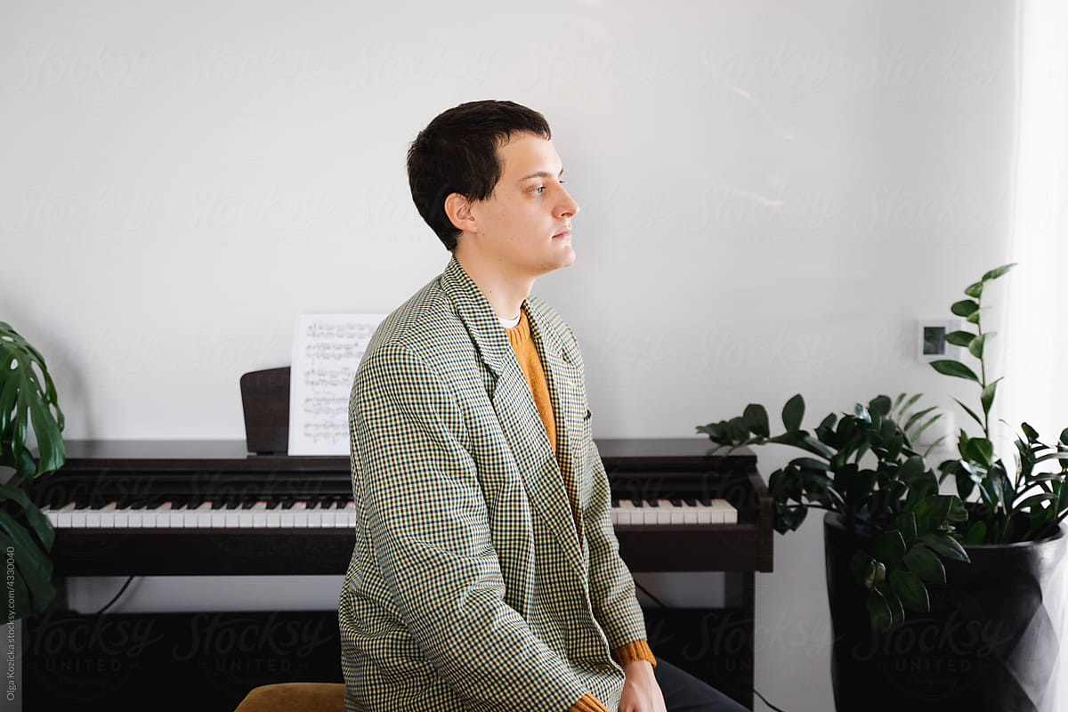 Musician Sitting By Piano