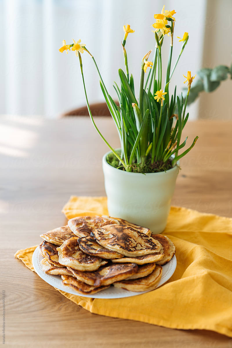Spring still life with pancakes and daffodil.