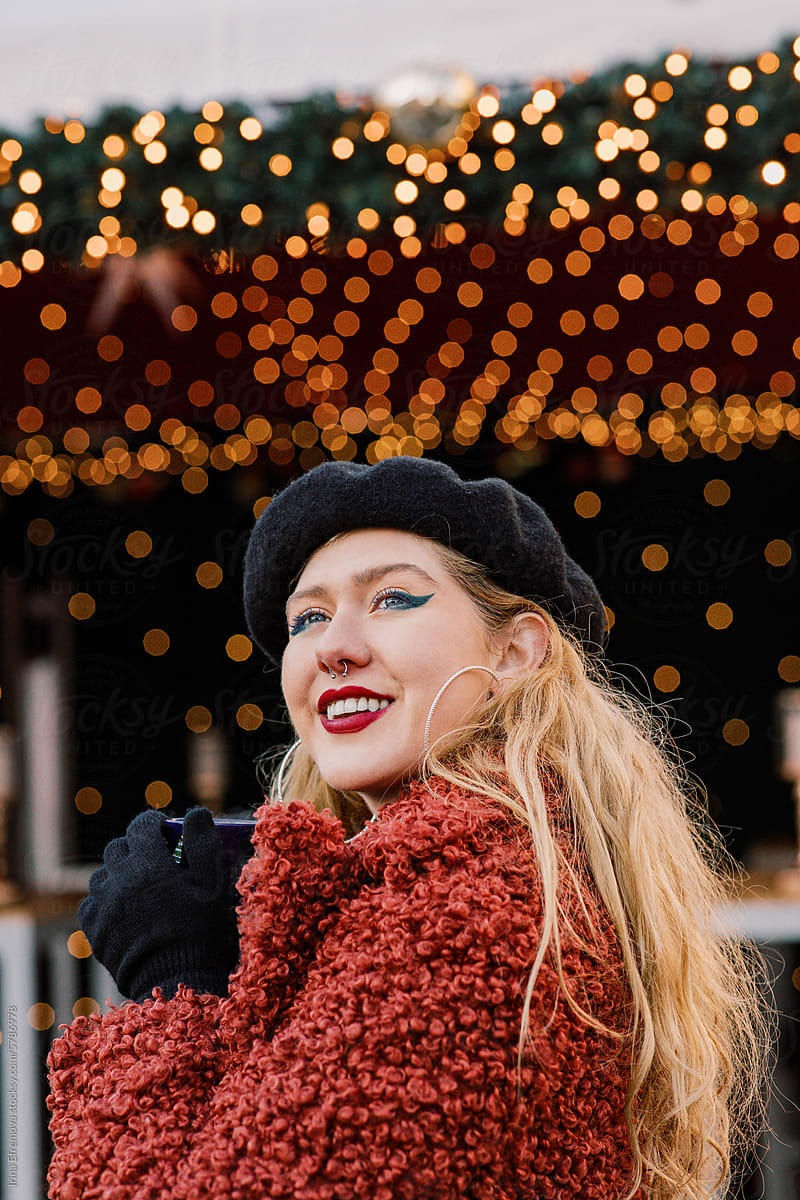 Blond Woman and Mulled Wine Smile at Christmas Market