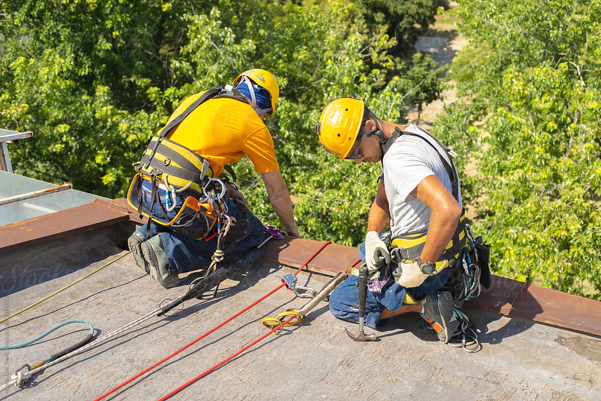 Working at elevations. Rope access, high-altitude outdoor work.