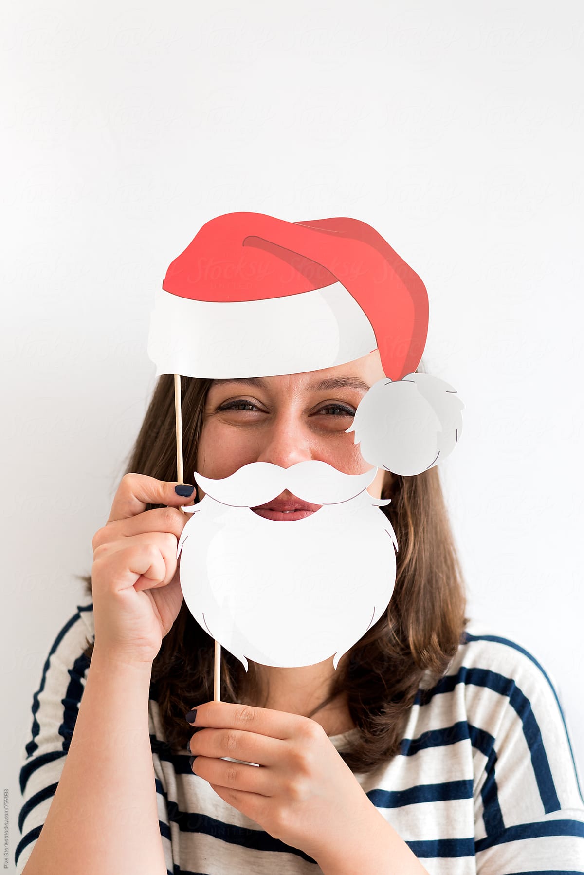 Joyful young woman in Santa disguise