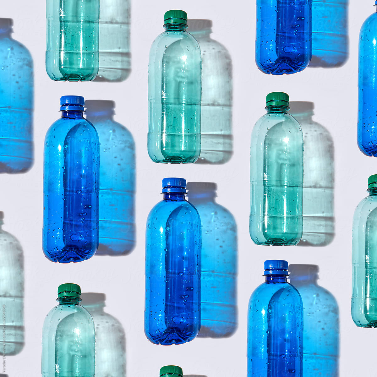 Different plastic bottles on a light background