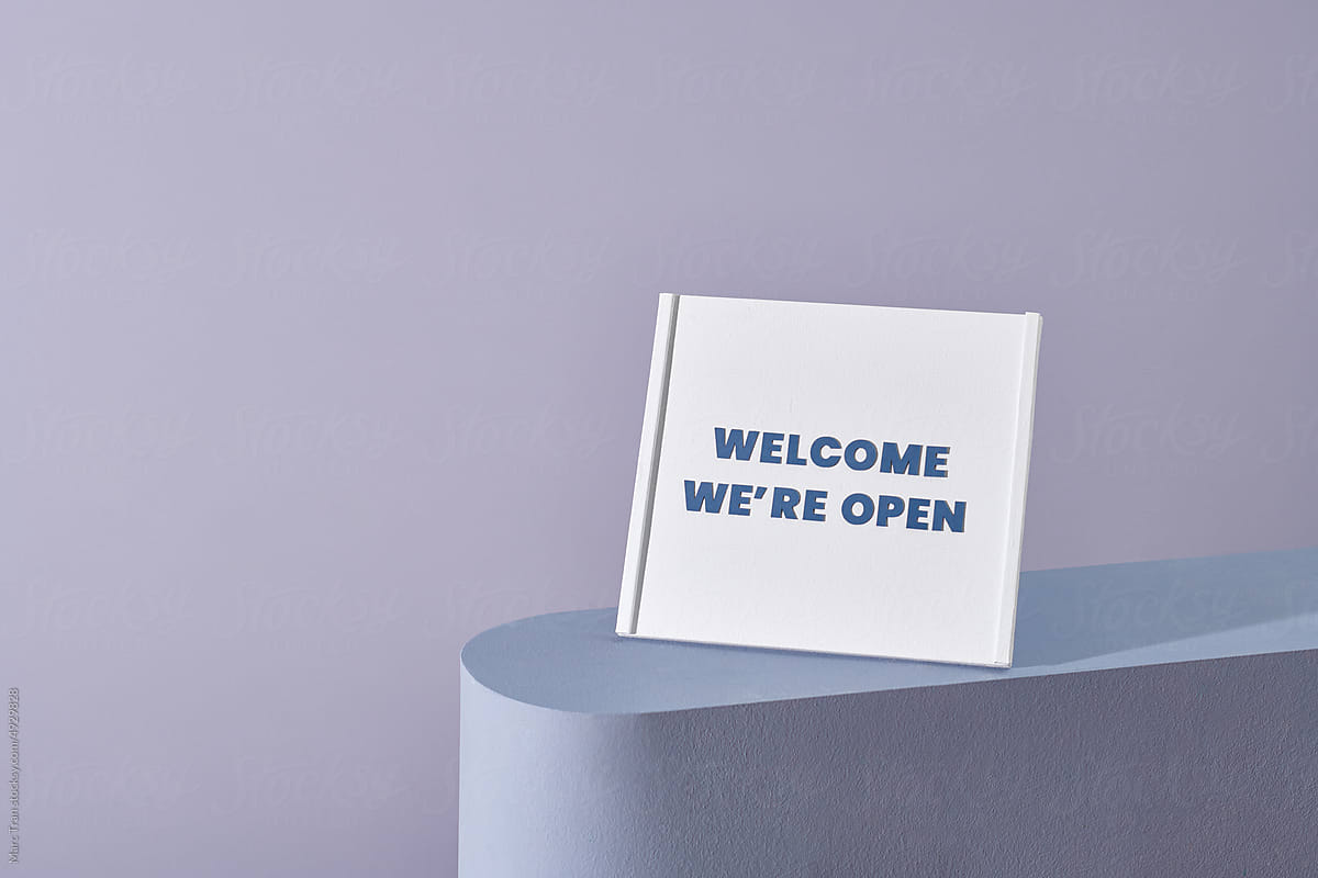 Welcome We\'re Open typography text on the whiteboard