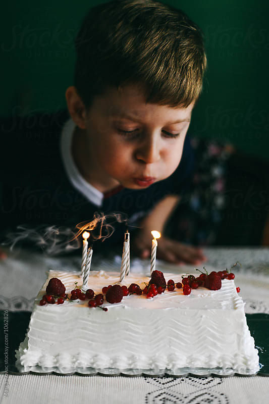 Kid blowing candles