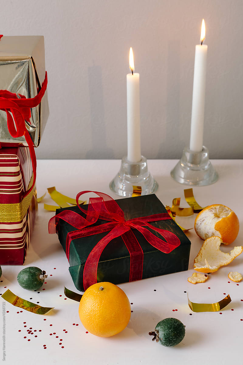 Christmas gifts with fruits and candles