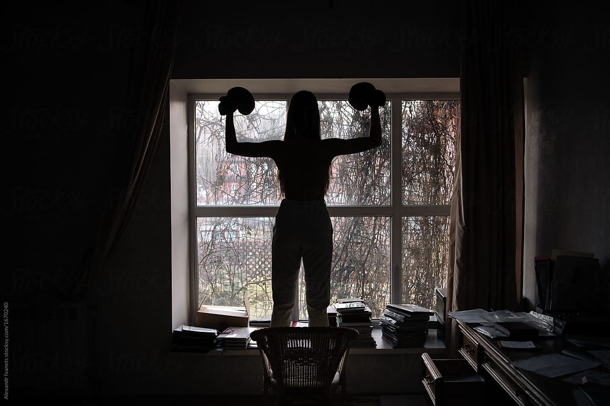 Silhouette of model in boxing gloves