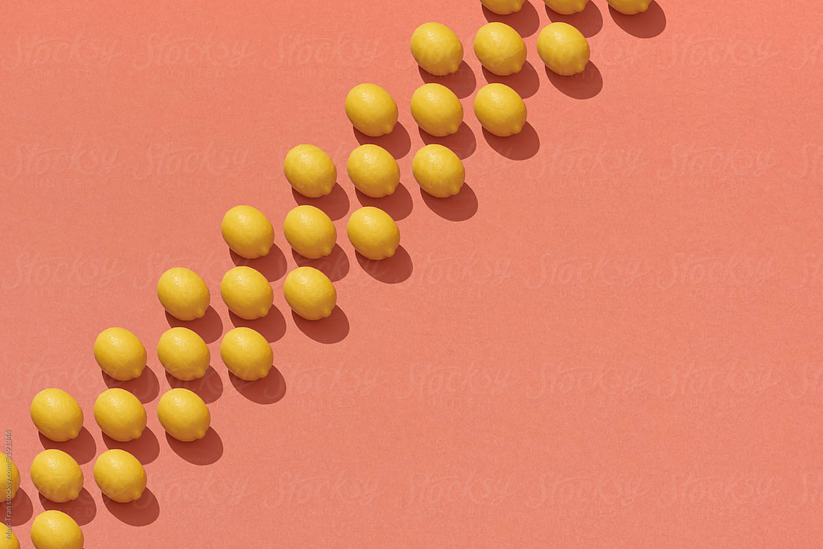 Top view of fresh lemon isolated on red background.
