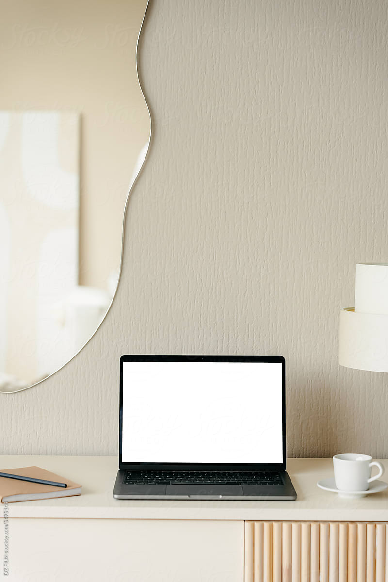 Laptop with a white screen in the home interior