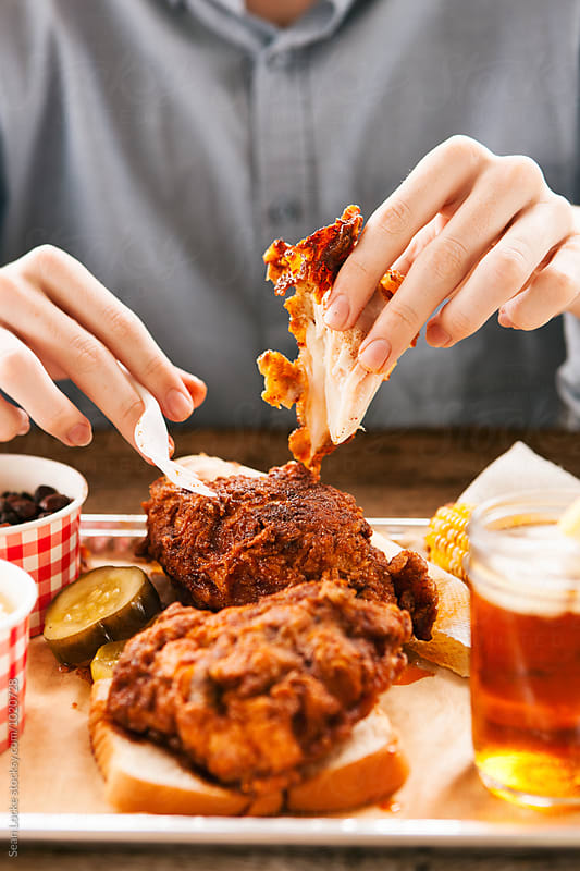 Fried: Man Pulling Apart Hot Chicken Breast Meat