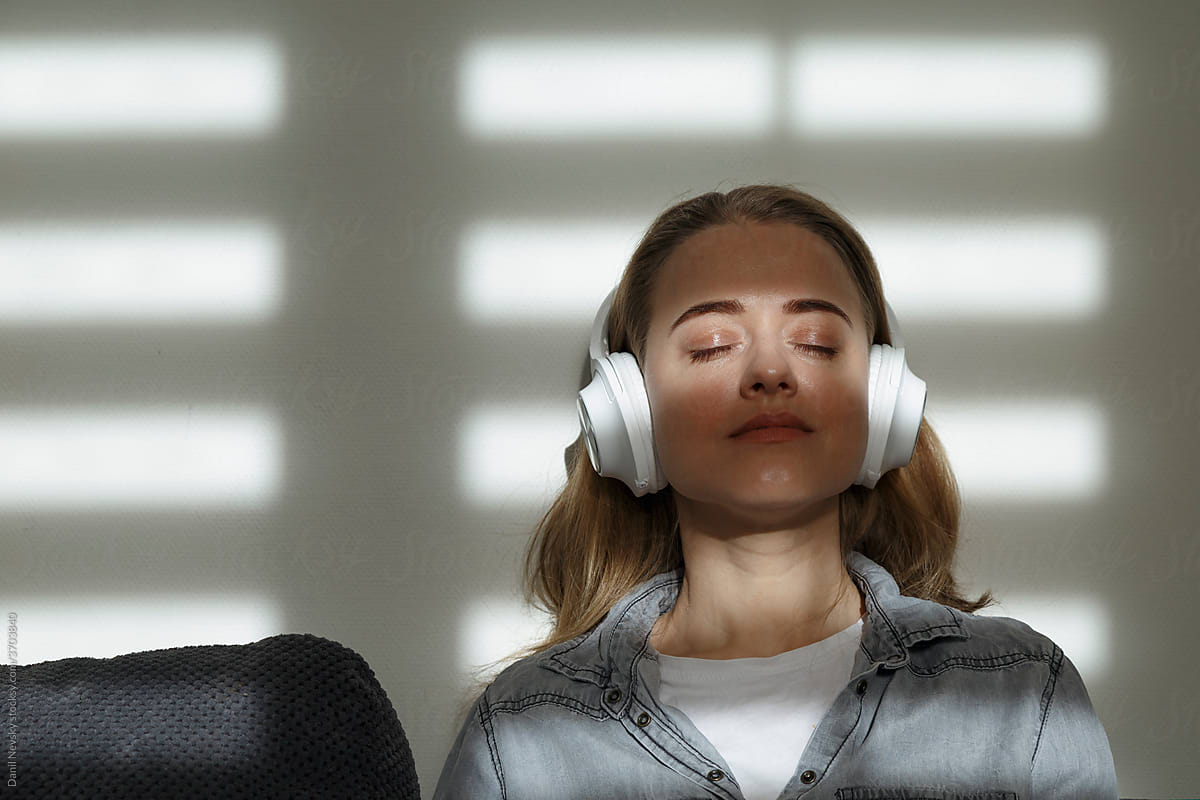 Serene woman listening to music with closed eyes