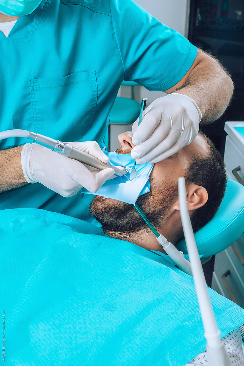 Dental Surgeon and patient during surgical intervention