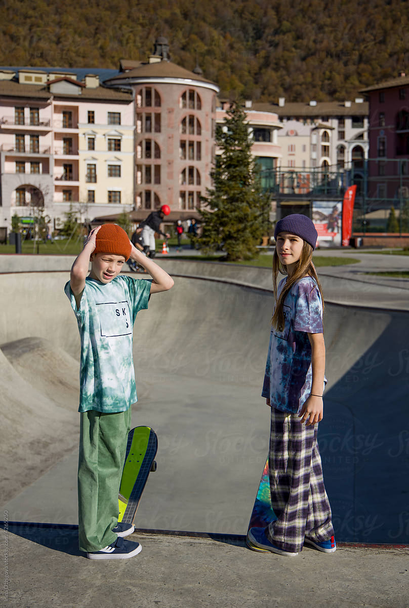 Two skaters in a autumn skate-park