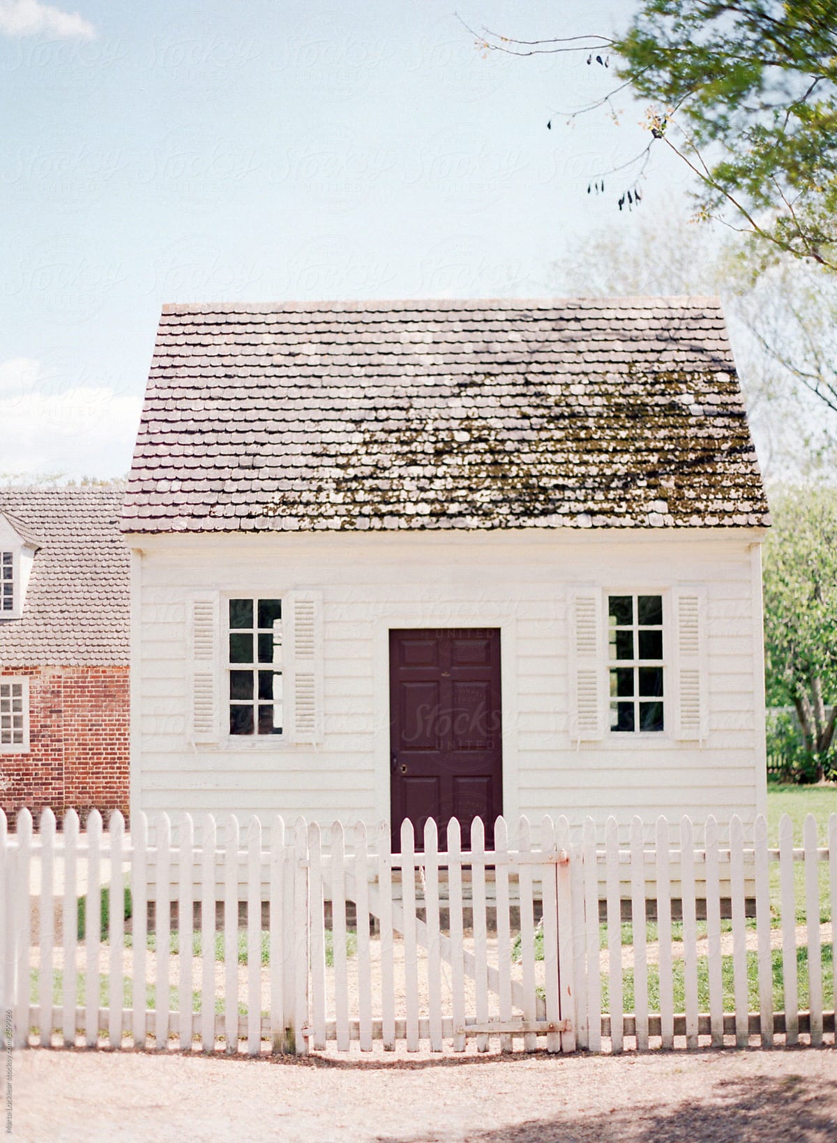 Small white colonial builing workshop