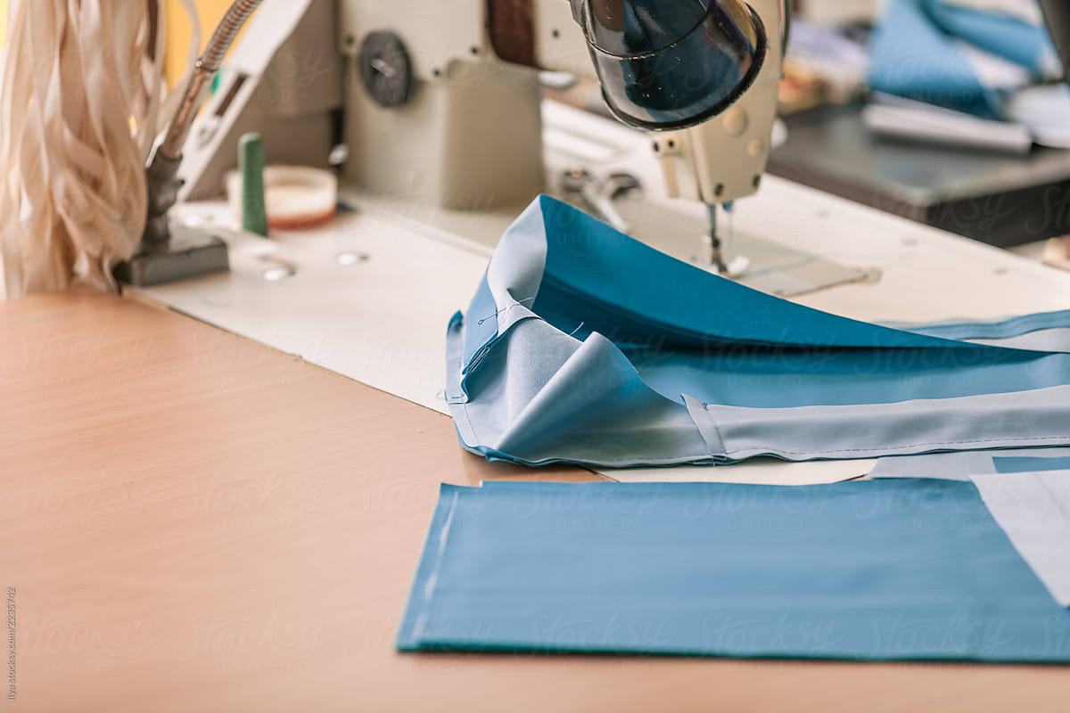 Woman work sewing machine sew cloth fabric