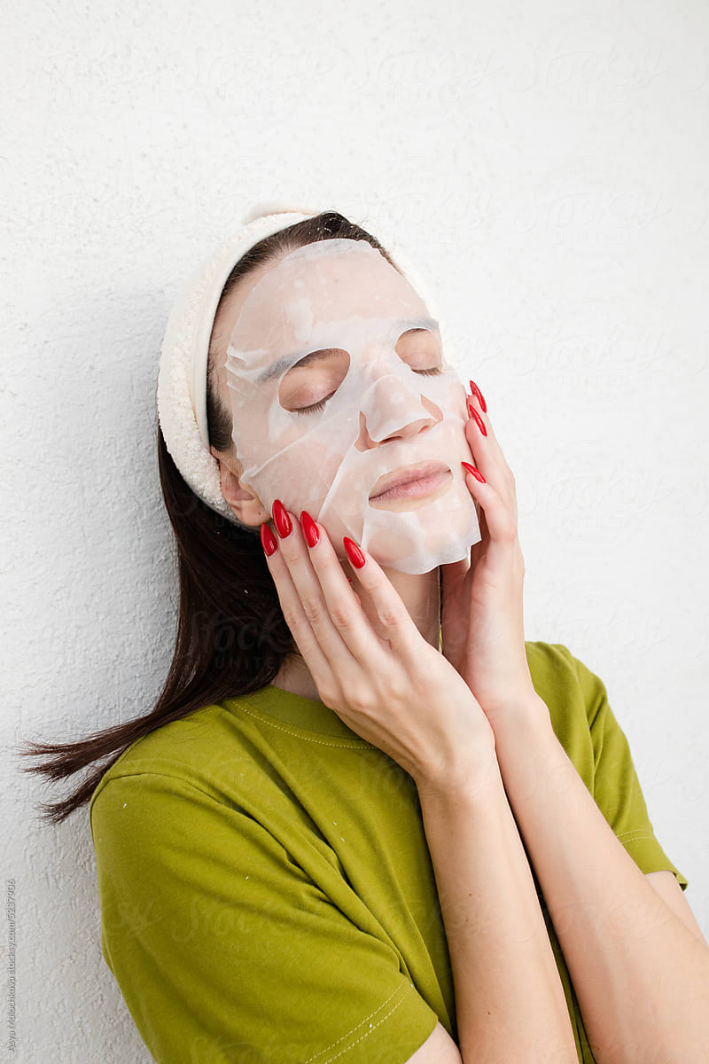 Caucasian Woman Applying Sheet Mask