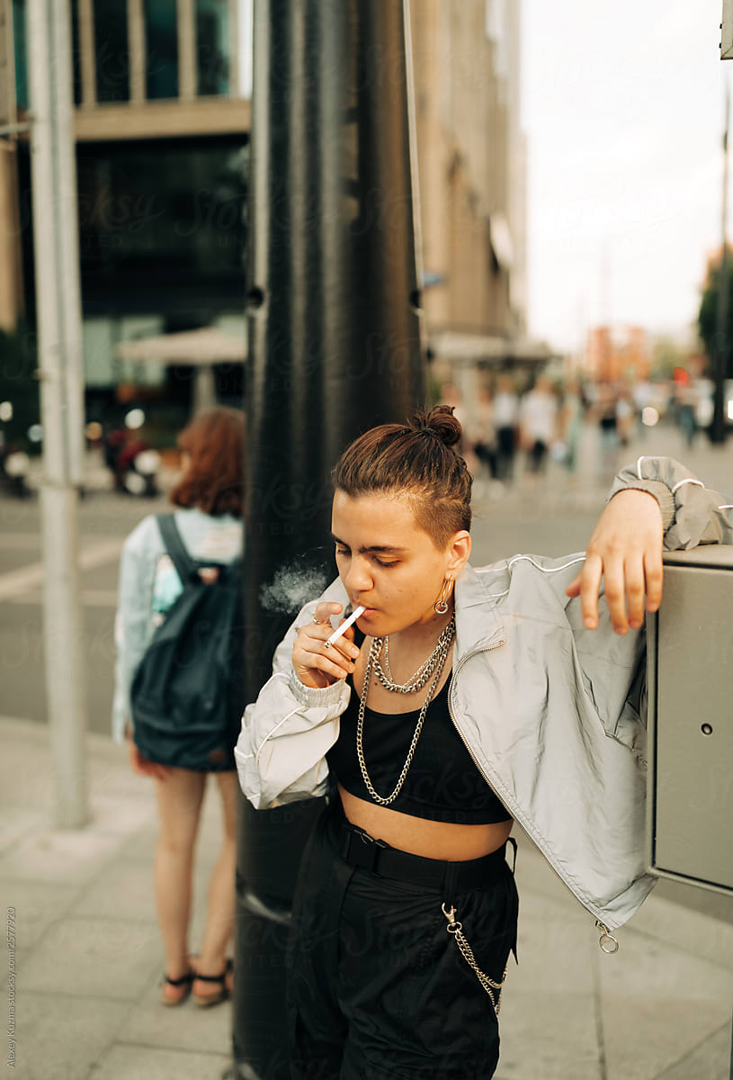 Lesbian Woman Smoking On The Street By Stocksy Contributor Alexey
