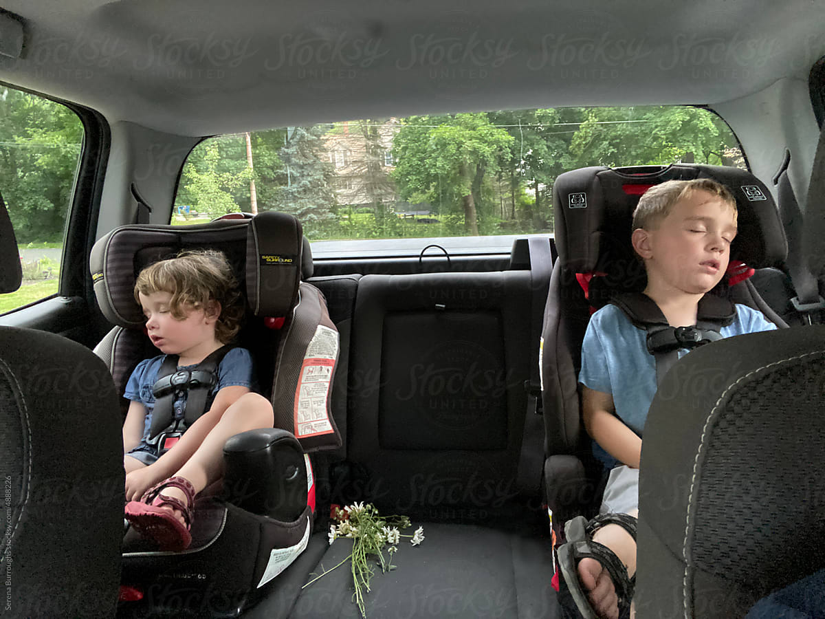 ugc of two children asleep in car seat