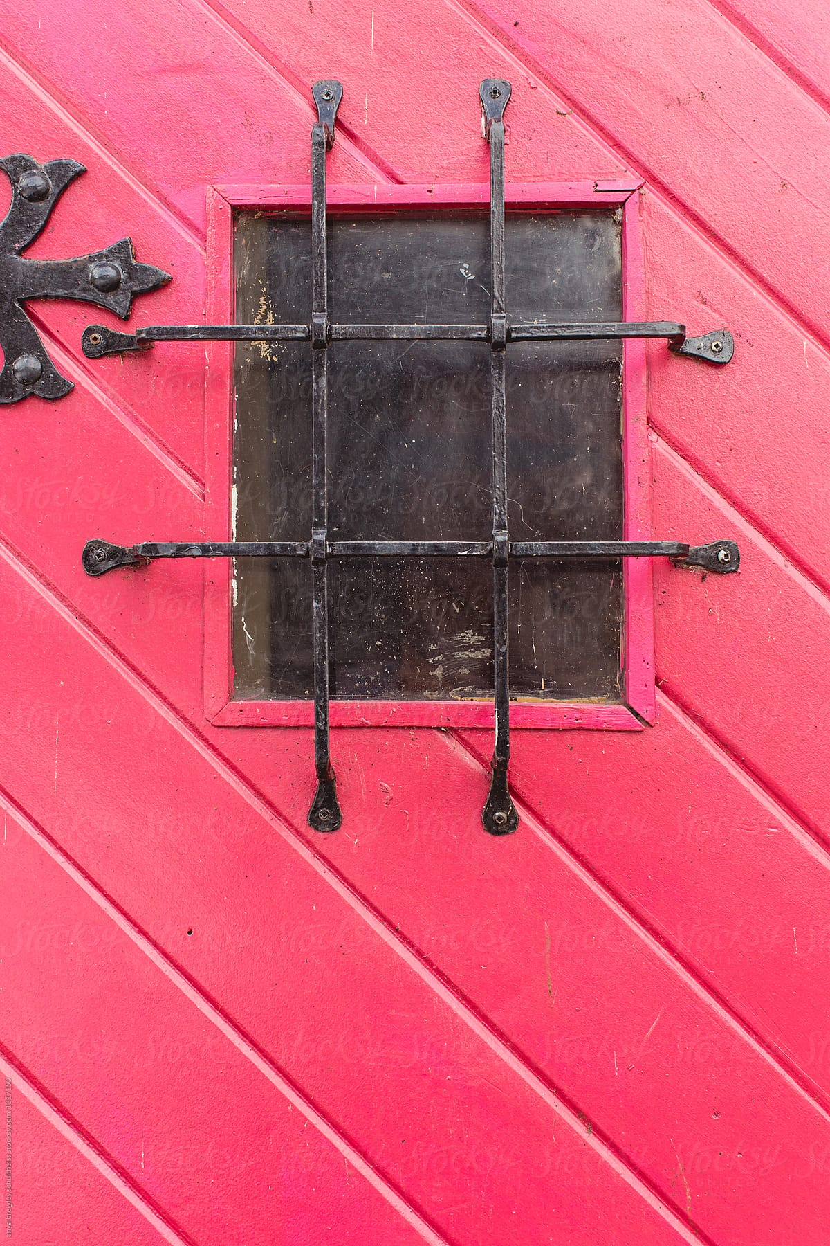 Vibrant antique red door with window