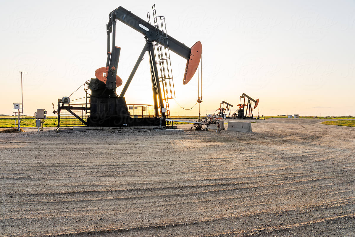oil field pump in sunset