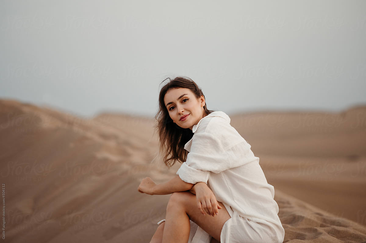 Pretty woman on sand dune.