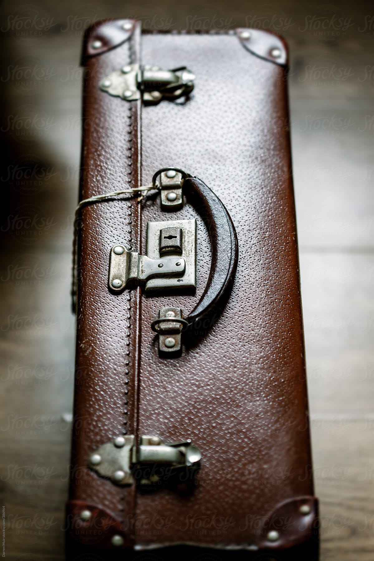 Vintage brown leather suitcase.