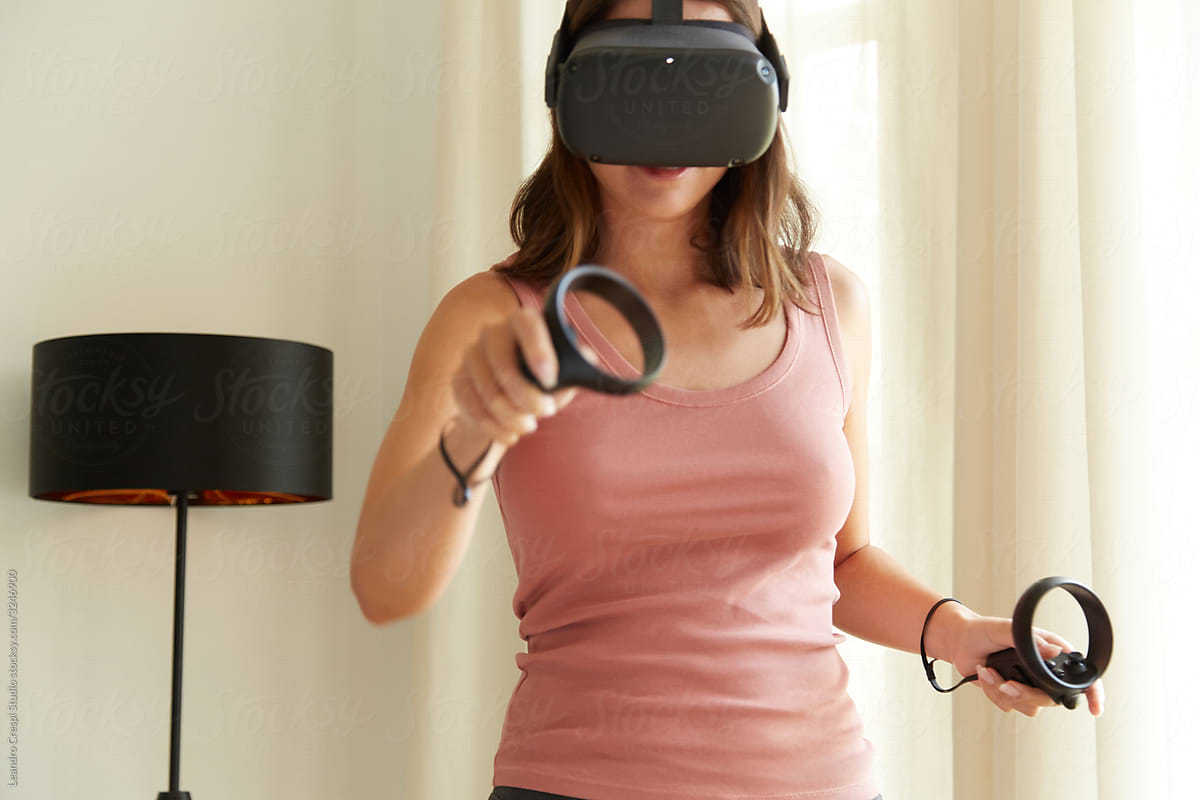 Young woman gaming in VR