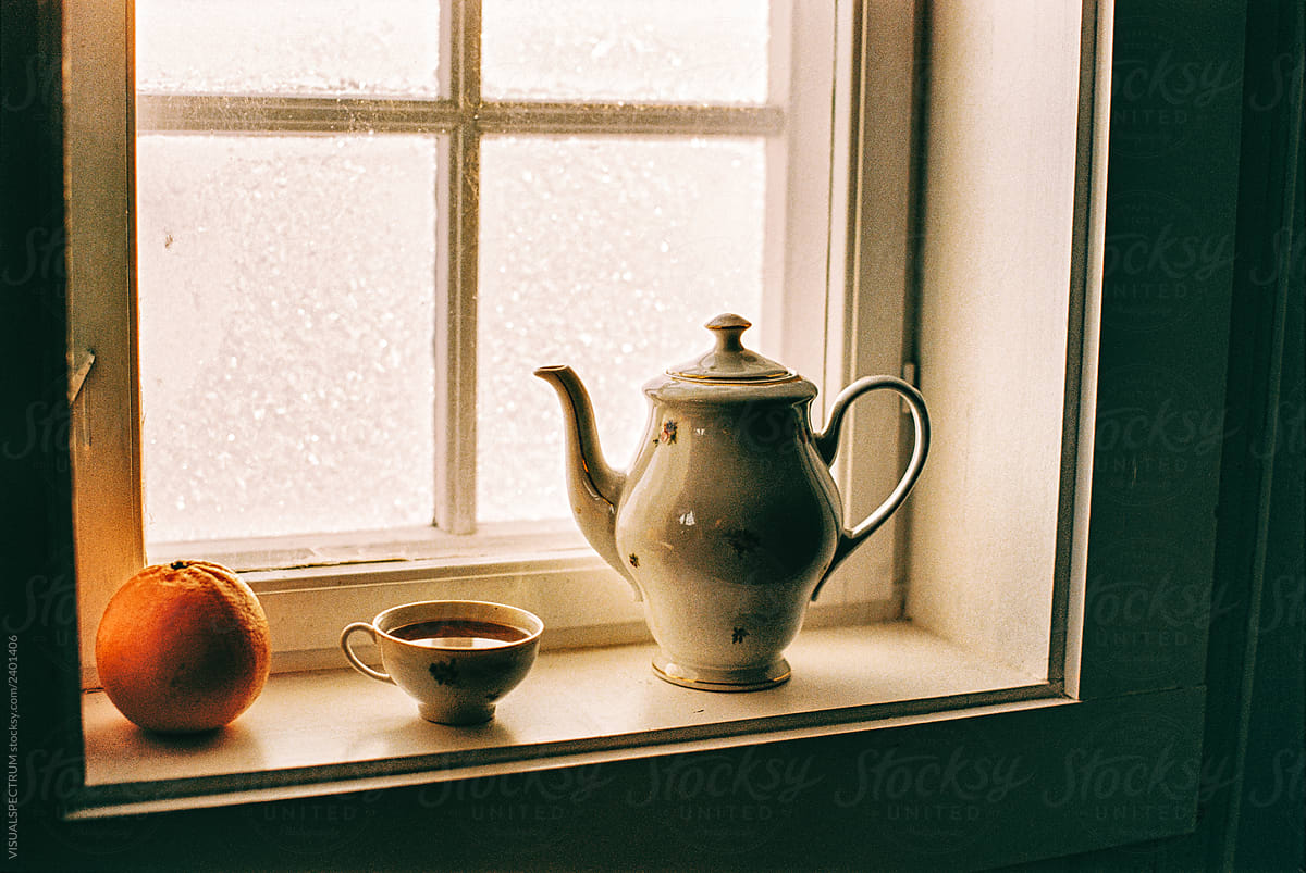 Cup of Steaming Black Coffee in Vintage Porcelain By Cabin Window