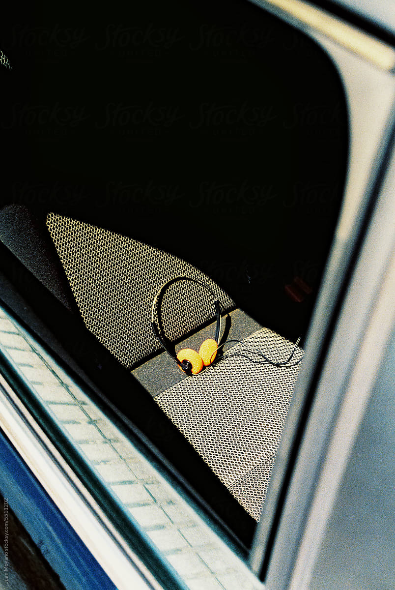 retro headphones on the seat of a car, 35mm film