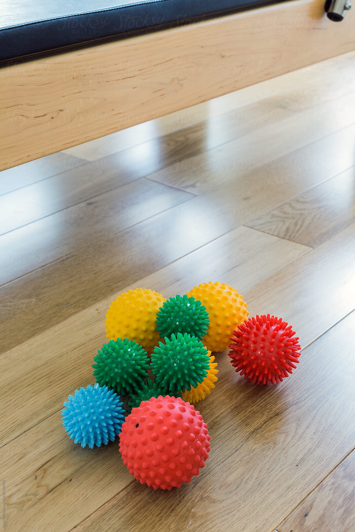 Spiky massage balls on the floor of a pilates studio