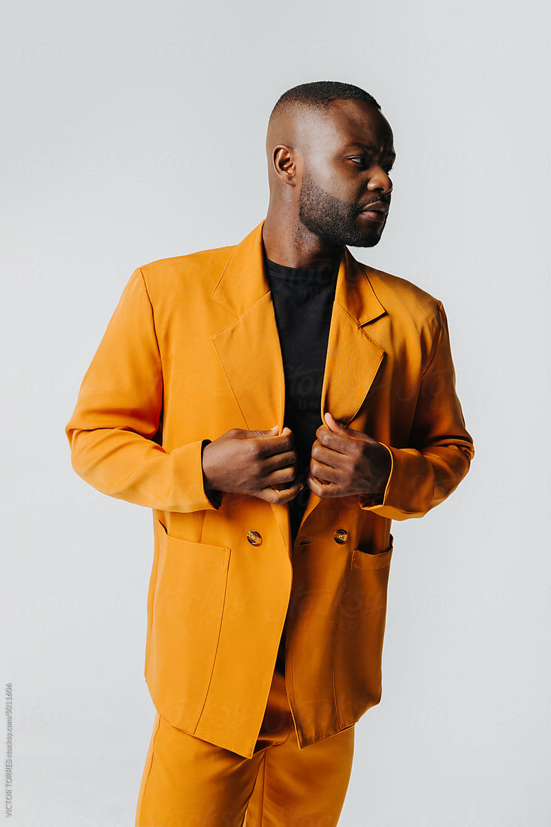 Elegant black man with orange suit