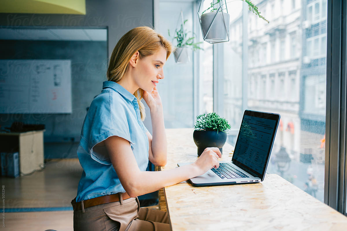 Businesswoman Working On Her Laptop By Stocksy Contributor Lumina Stocksy