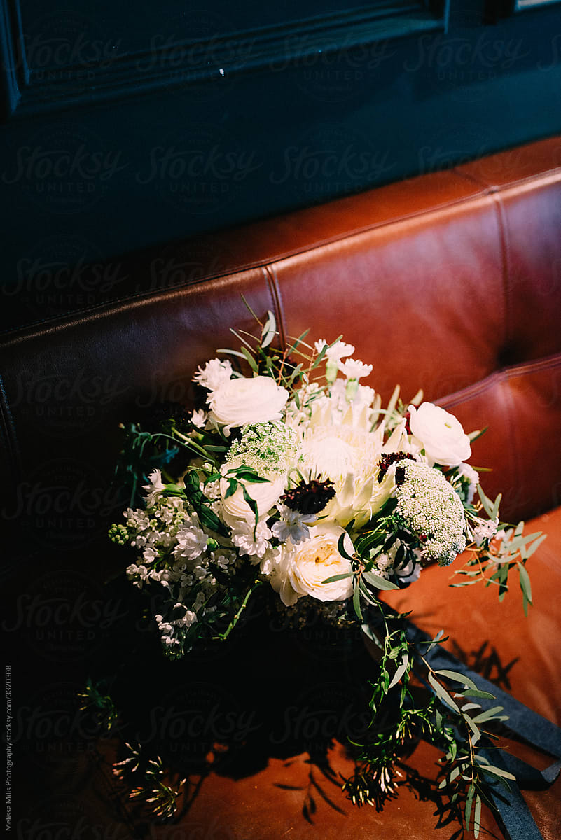 wedding bouquet on a hidden bench at indoor wedding venue