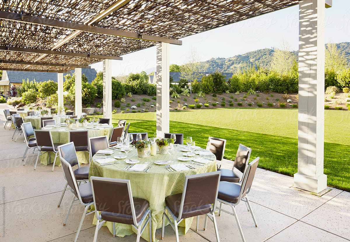Outdoor wedding reception set up at a resort by lawn