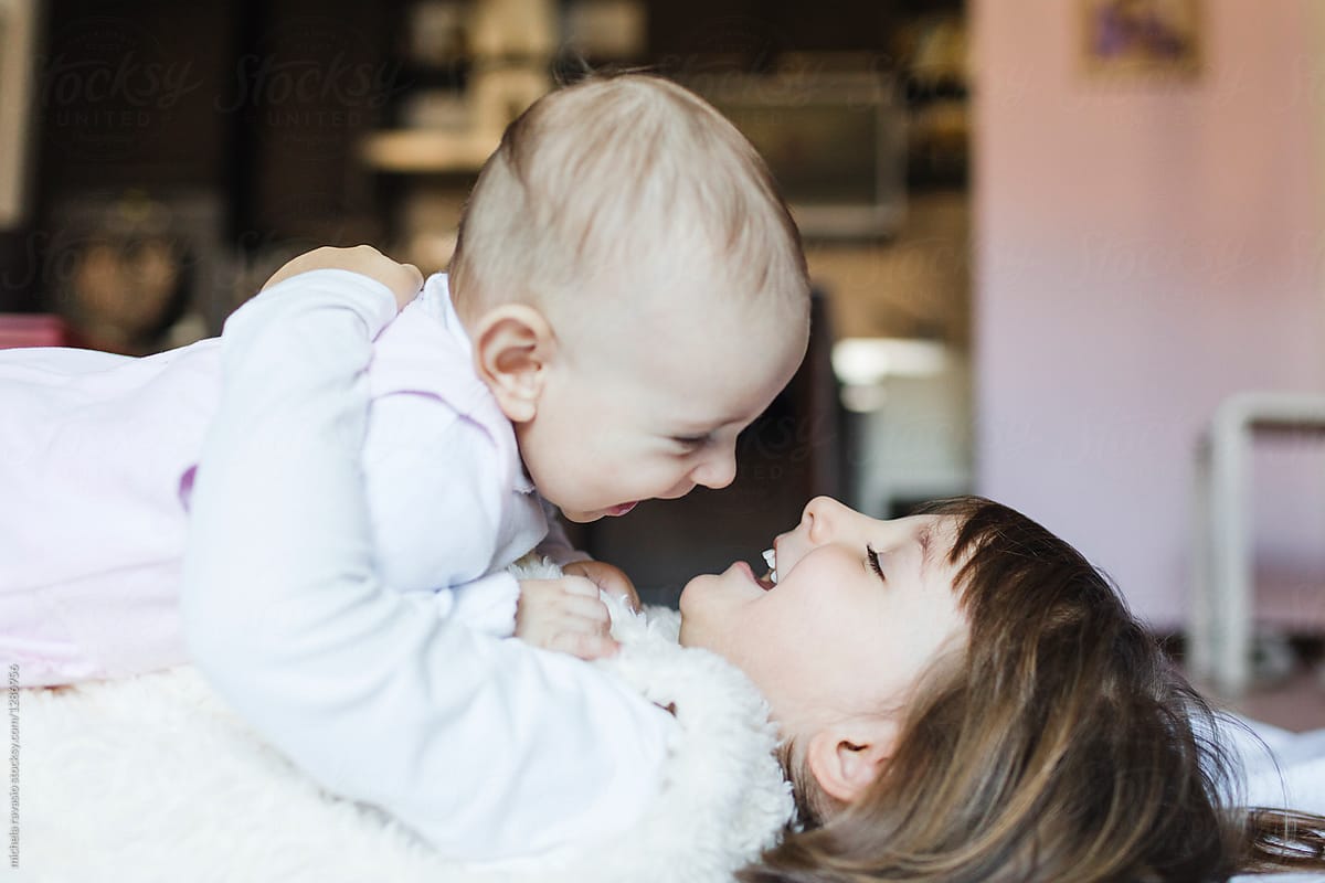 Two Little Sisters Having Fun Together At Home By Stocksy Contributor Michela Ravasio Stocksy 