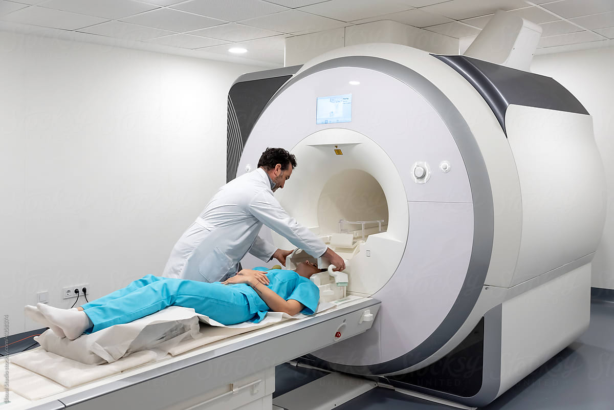 Doctor preparing patient for MRI procedure