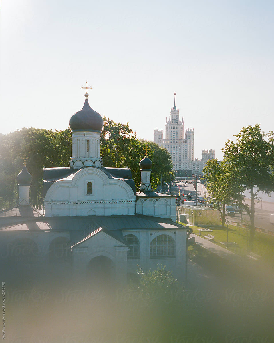 View of the old Orthodox church and the Stalin-style skyscraper in Moscow.