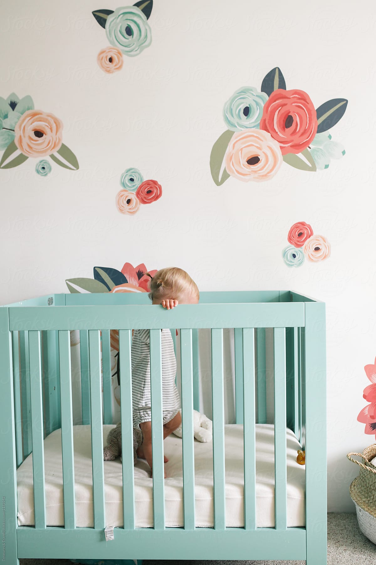 Toddler Standing in Her Crib