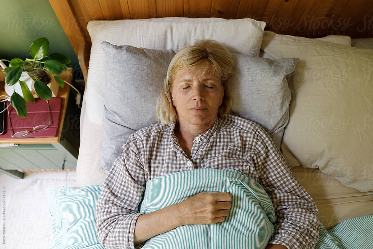 A sleeping senior woman in the bed