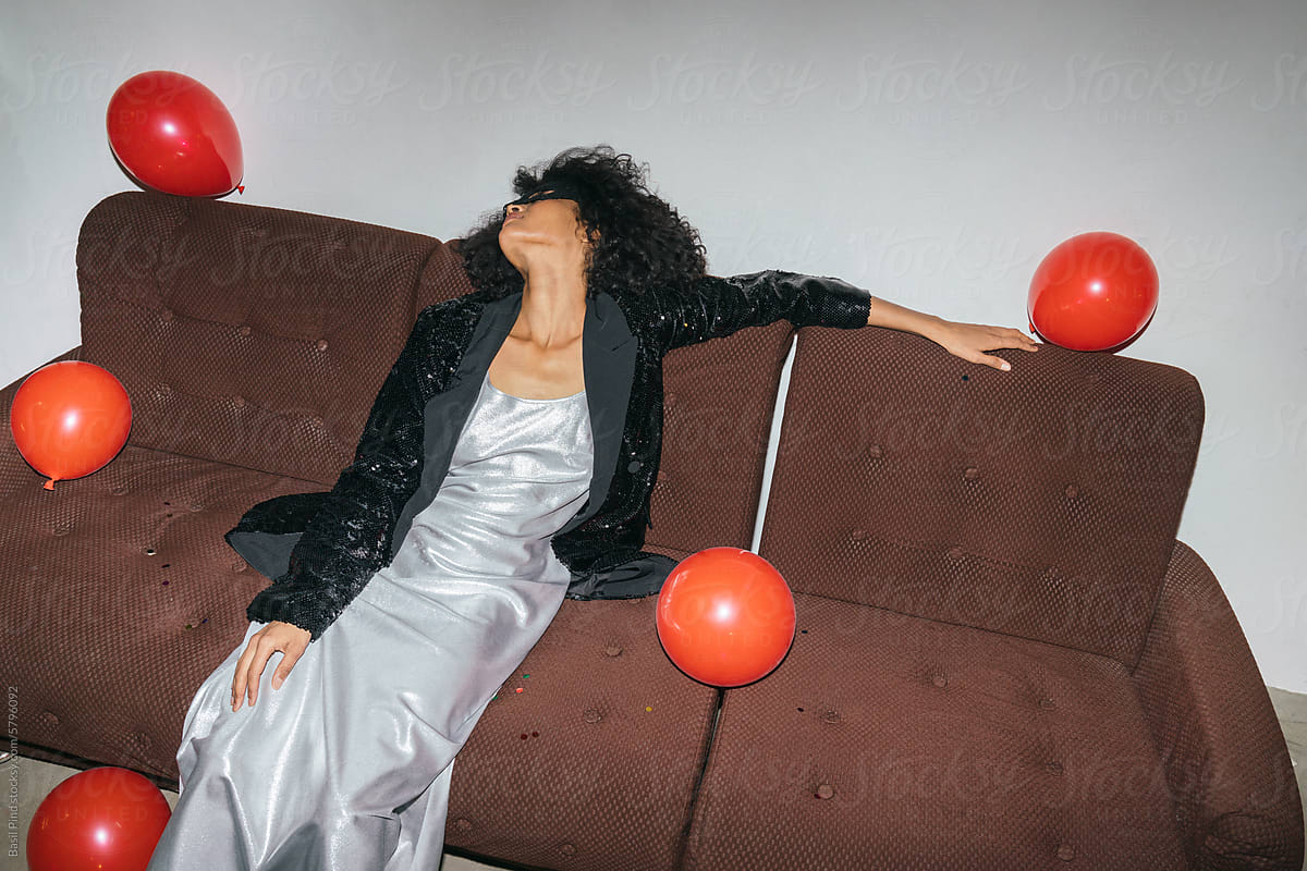 Hangover Recovery on Couch with Red Balloons
