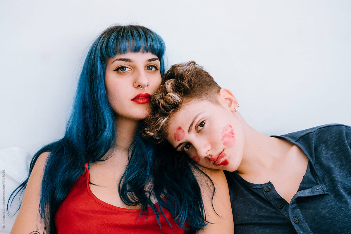 «a Couple Of Lesbians In Bed Leave Lipstick Marks On Their Faces Del Colaborador De Stocksy